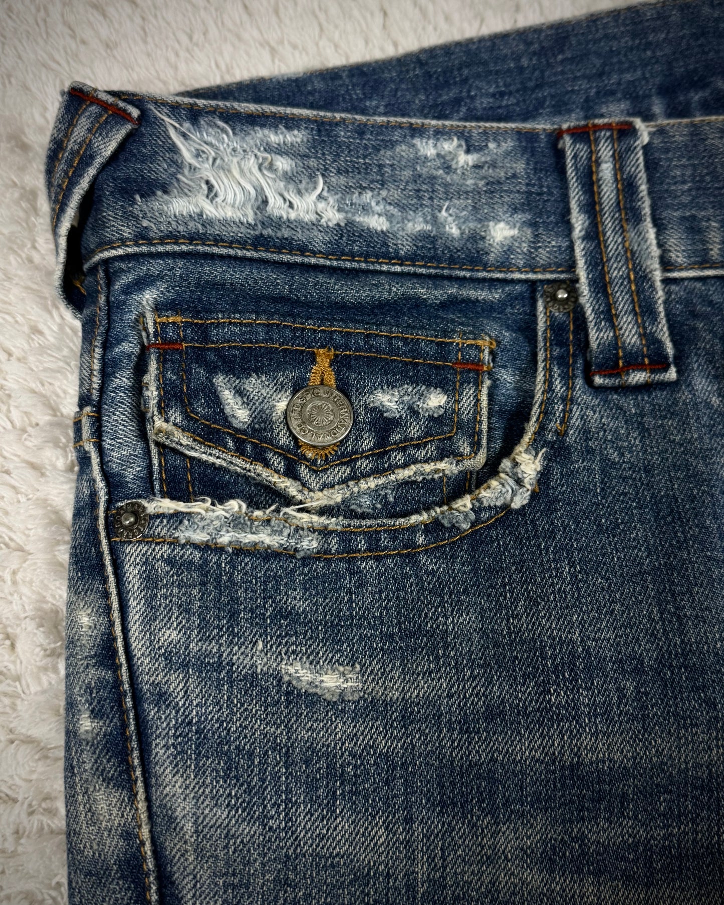 Tornado Mart Repaired Distressing Spiral Flared Jeans