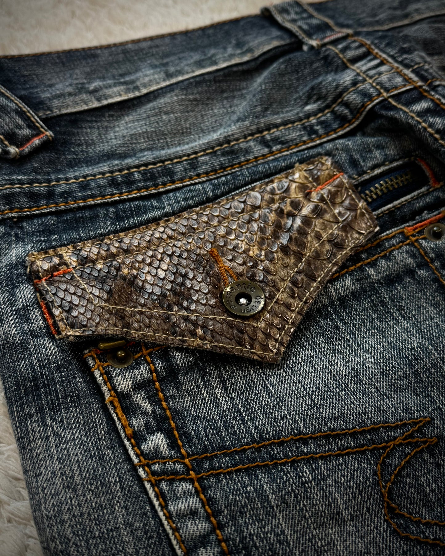 Semantic Design Python Pocket Detailed Spiral Flared Jeans