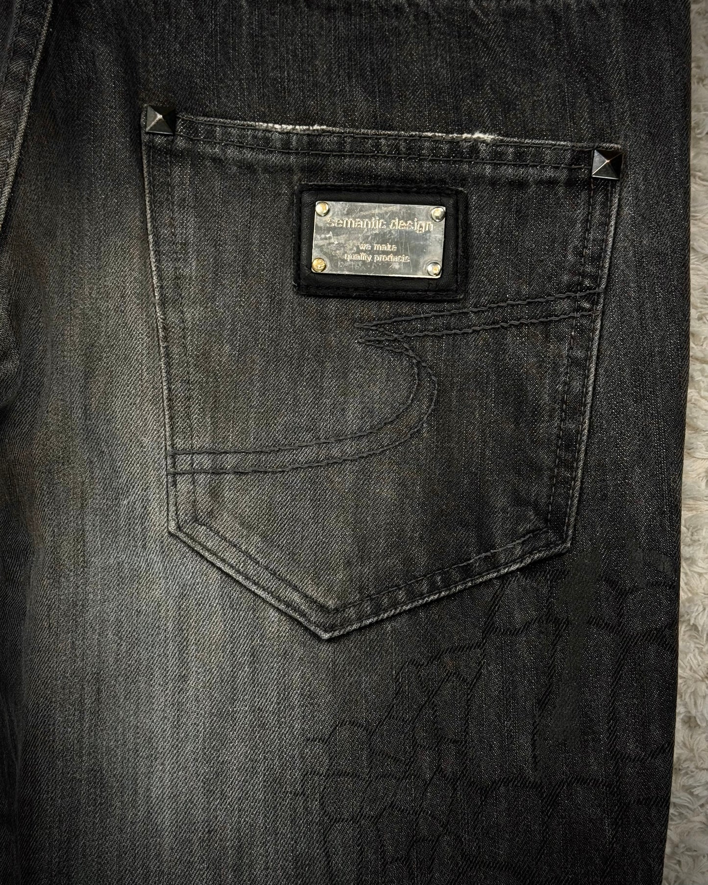 Semantic Design Crocodile Clawmarks Coated Flared Jeans