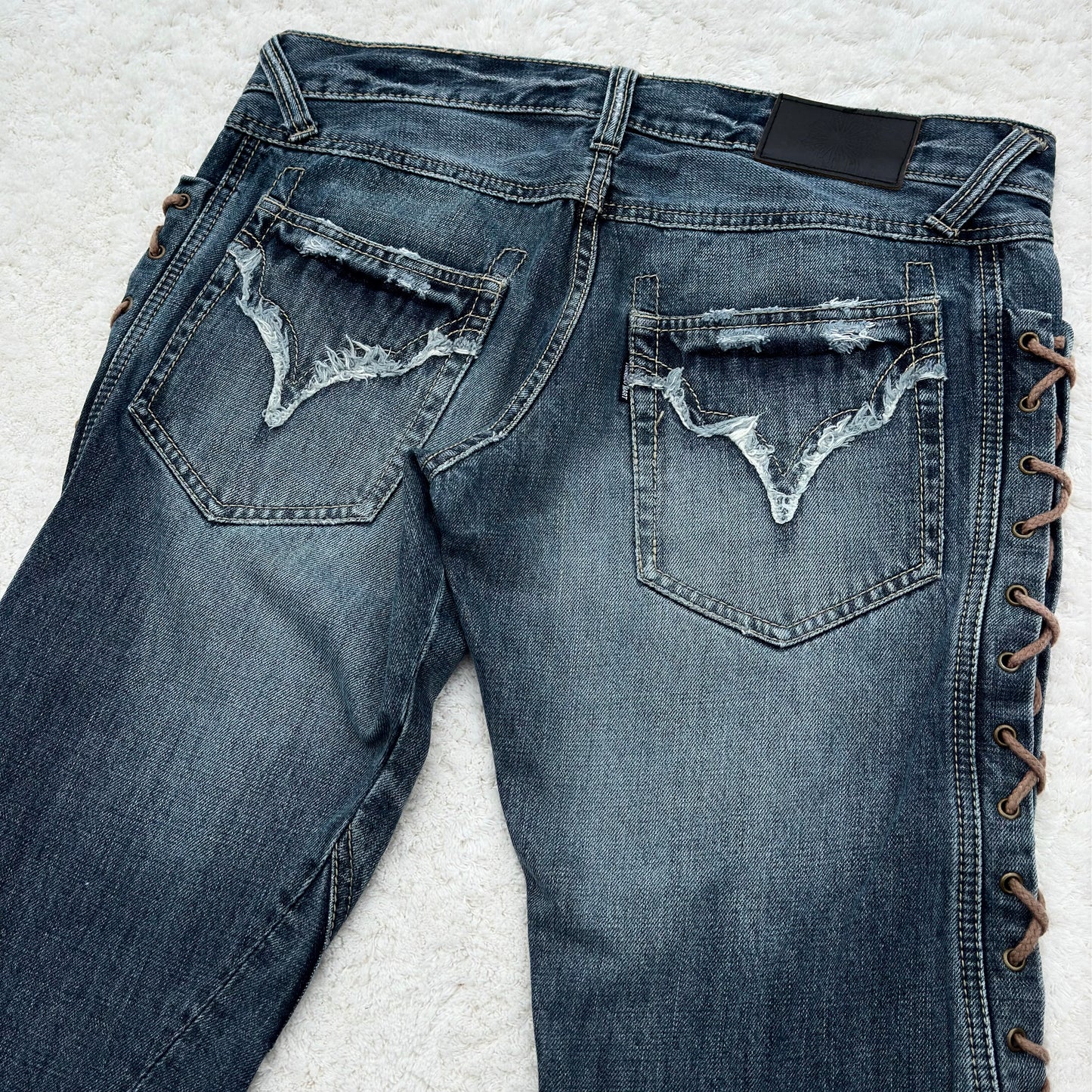 Tornado Mart Thigh Lace-Up Spiral Cut Flared Jeans