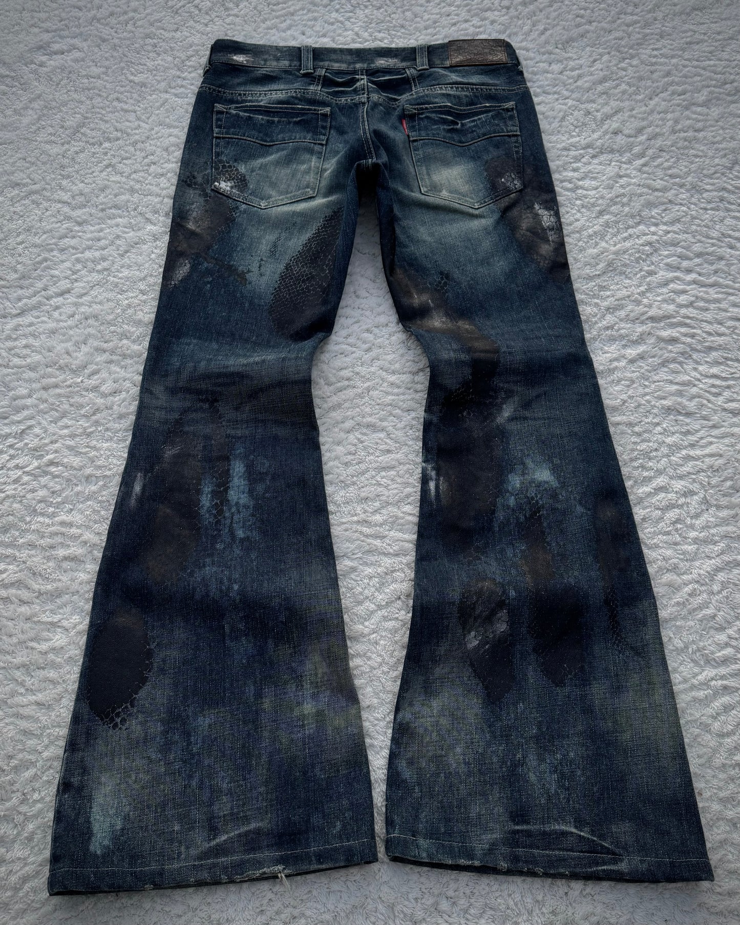Tornado Mart Snakeskin Imprinted Flared Jeans