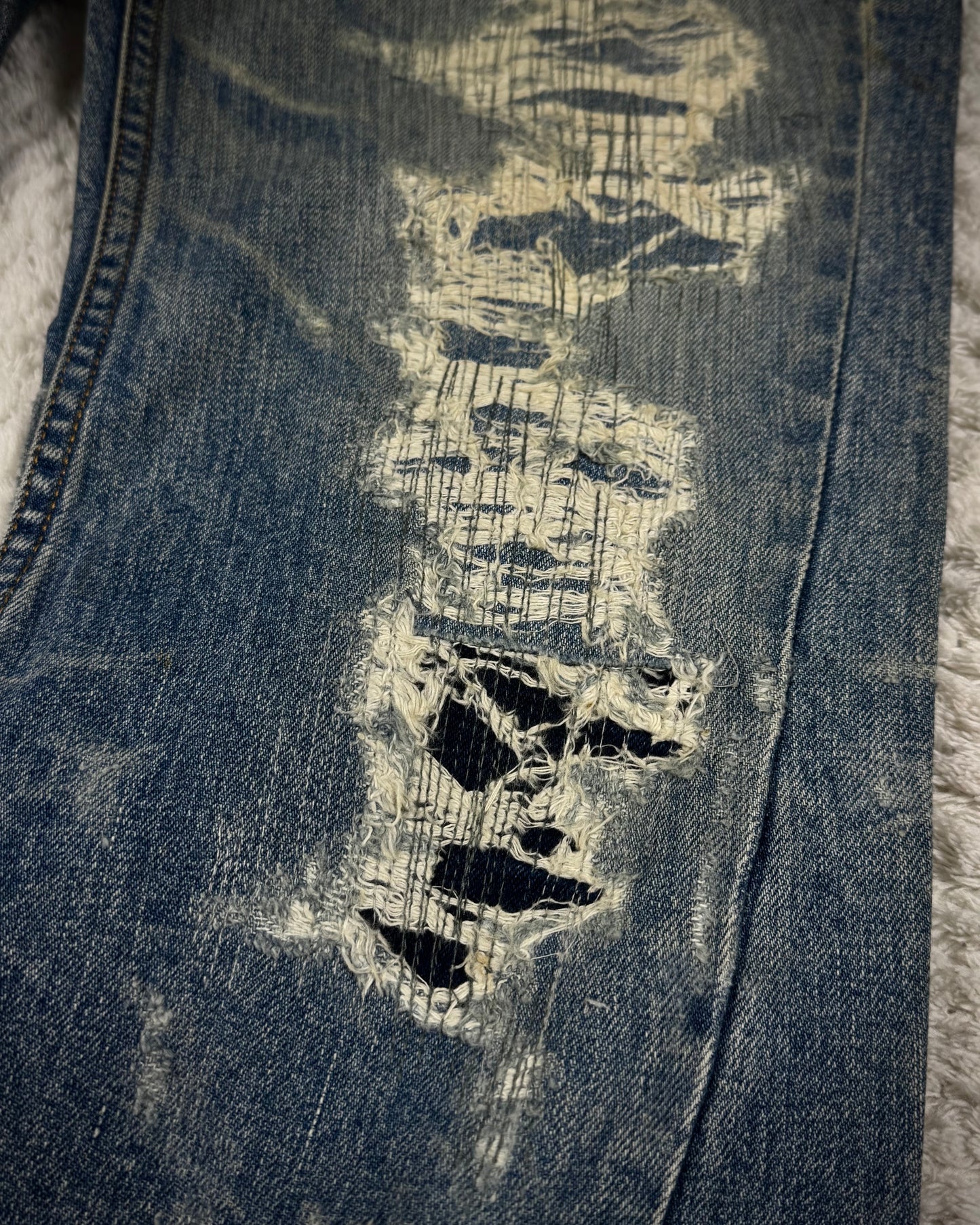 Tornado Mart Repaired Distressing Spiral Flared Jeans