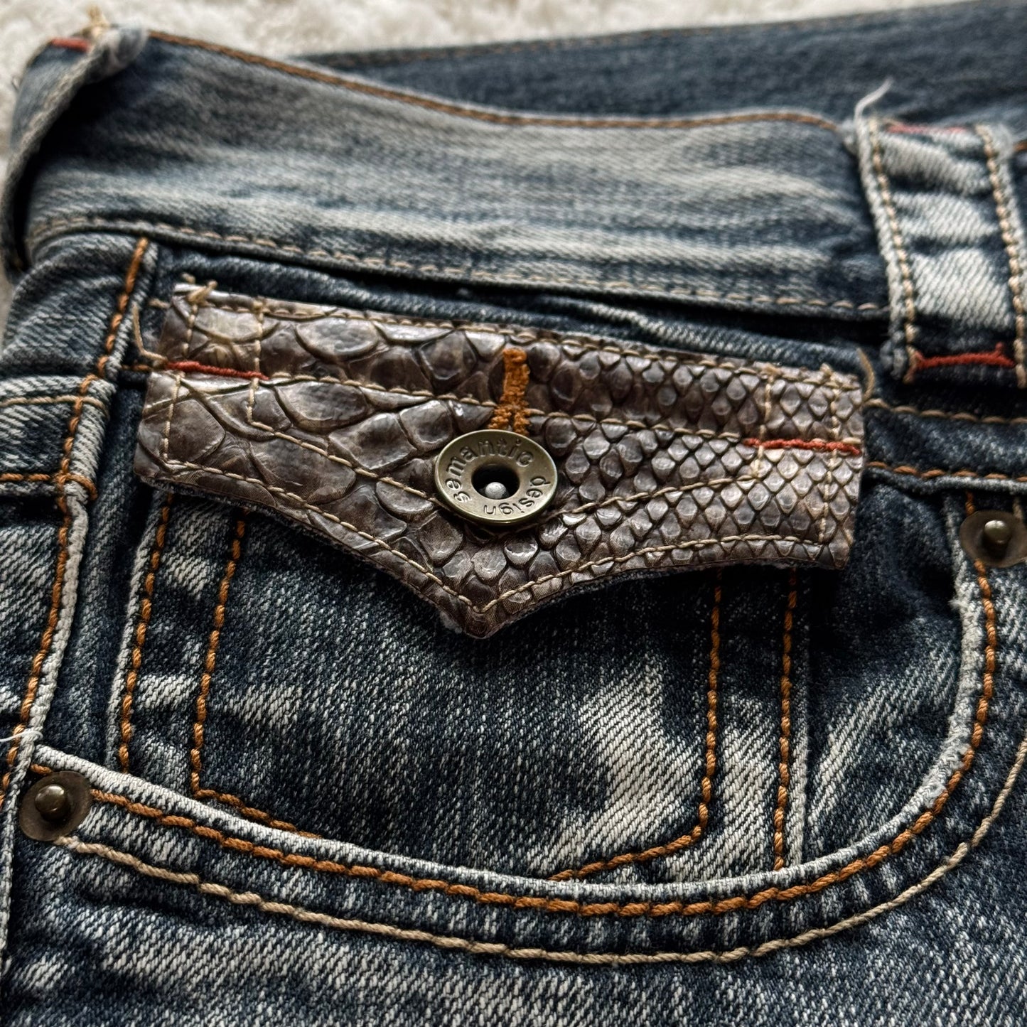 Semantic Design Zippered Python Detailed Flared Jeans