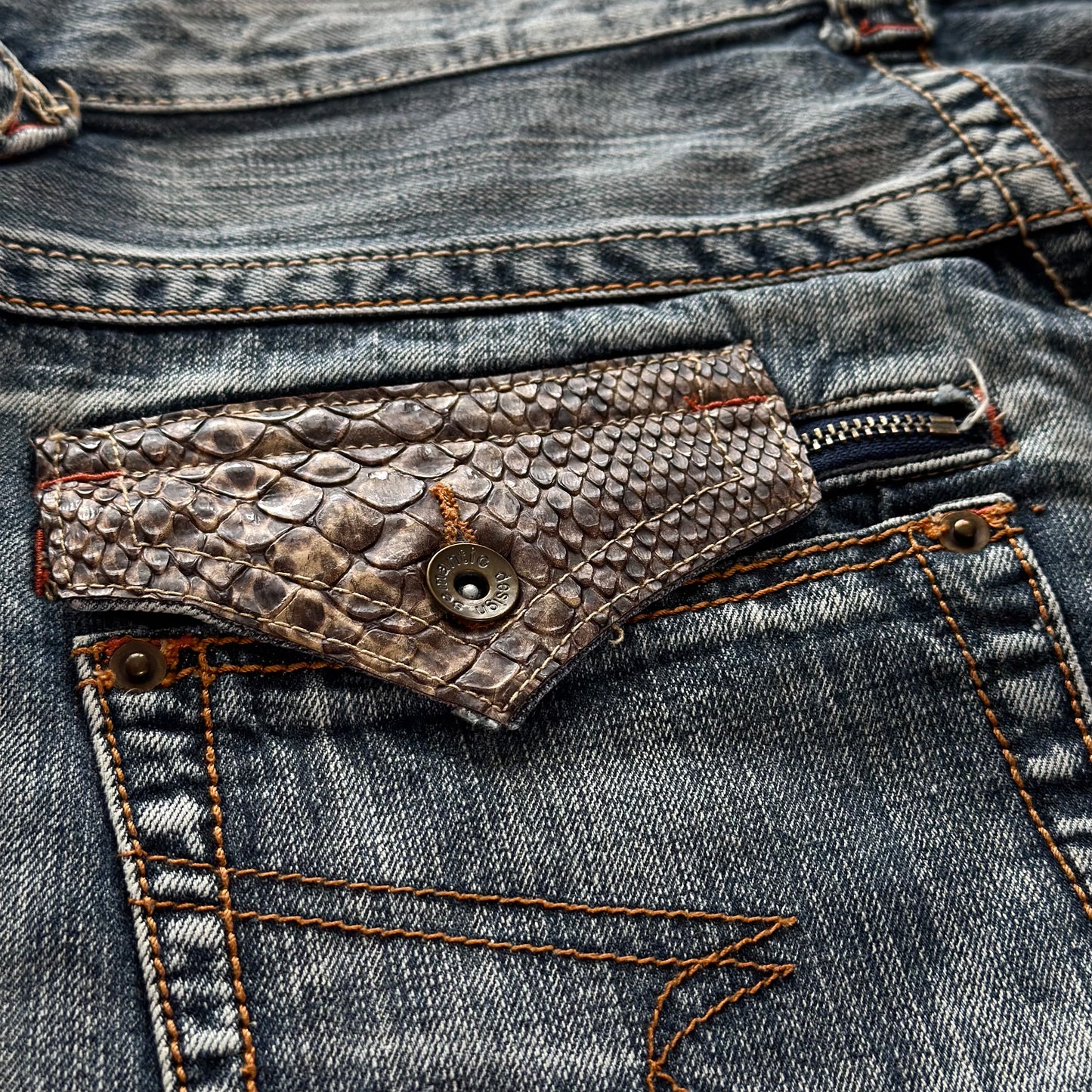 Semantic Design Zippered Python Detailed Flared Jeans