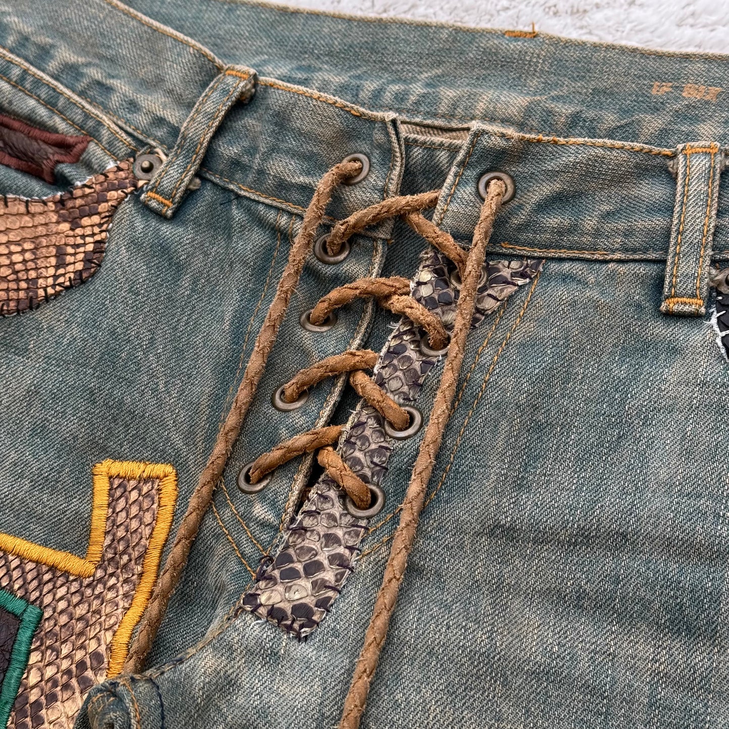 IfSixWasNine „Crazy Mexican“ Snakeskin Flared Lace-Up Jeans