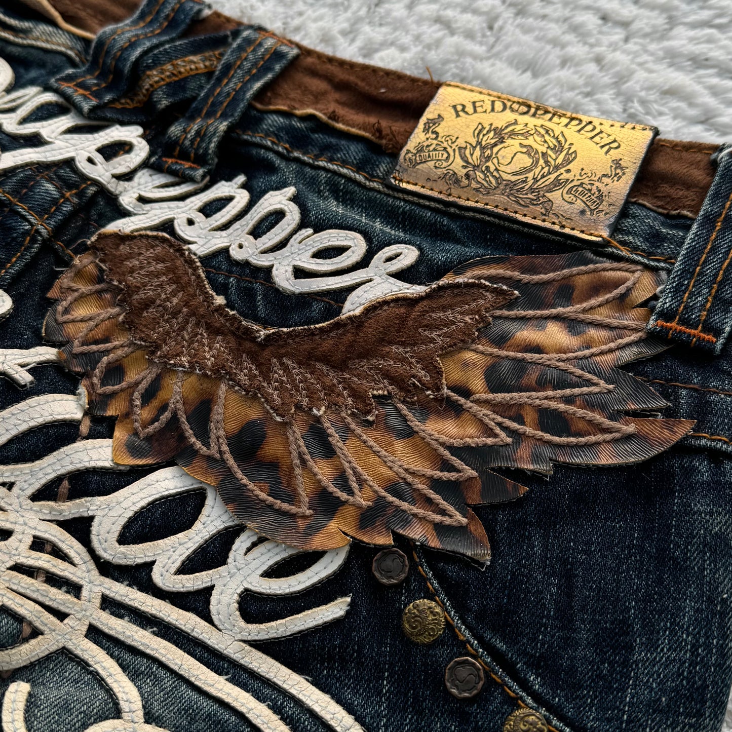 Red Pepper Cheetah Wings Flared Jeans