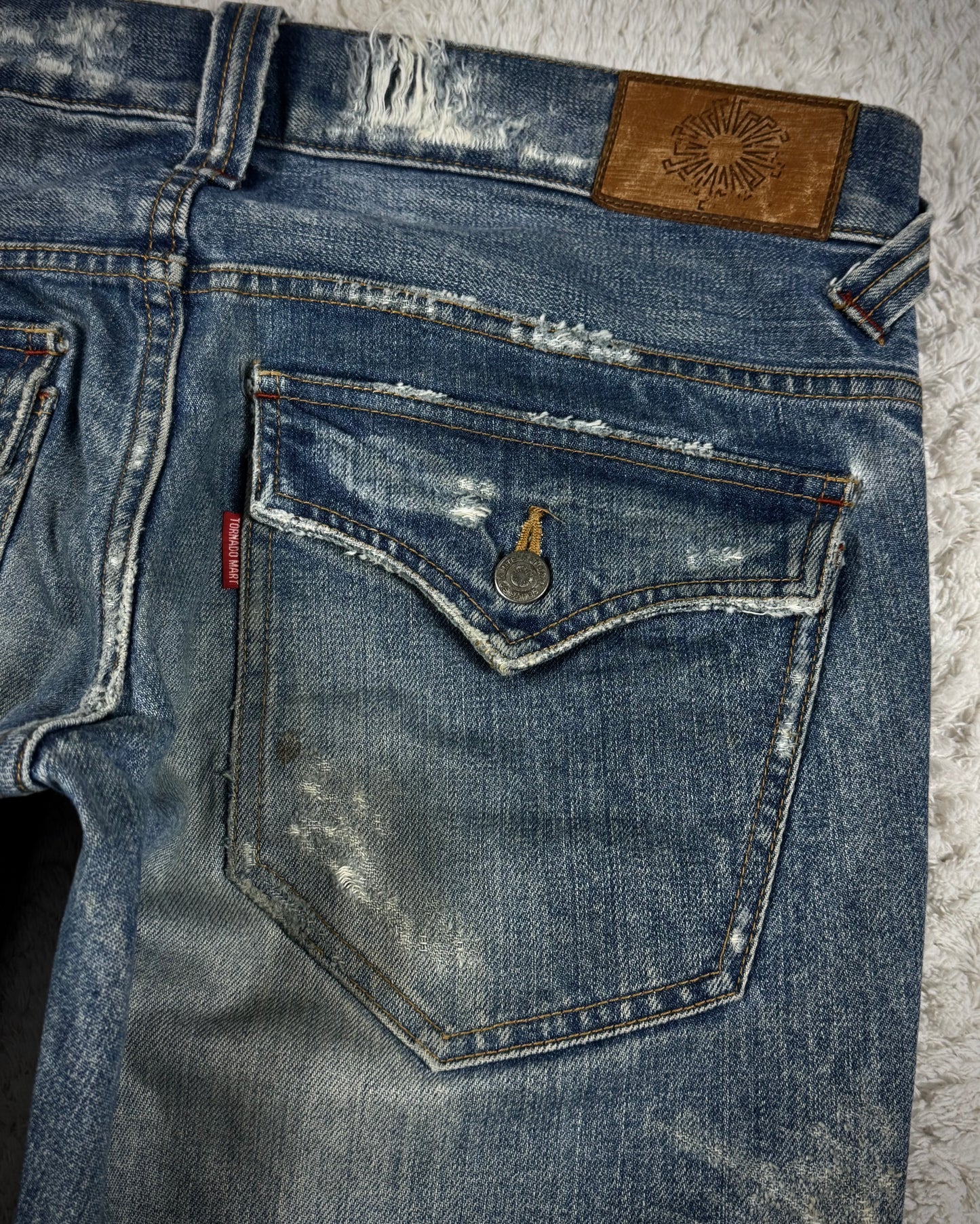 Tornado Mart Repaired Distressing Spiral Flared Jeans
