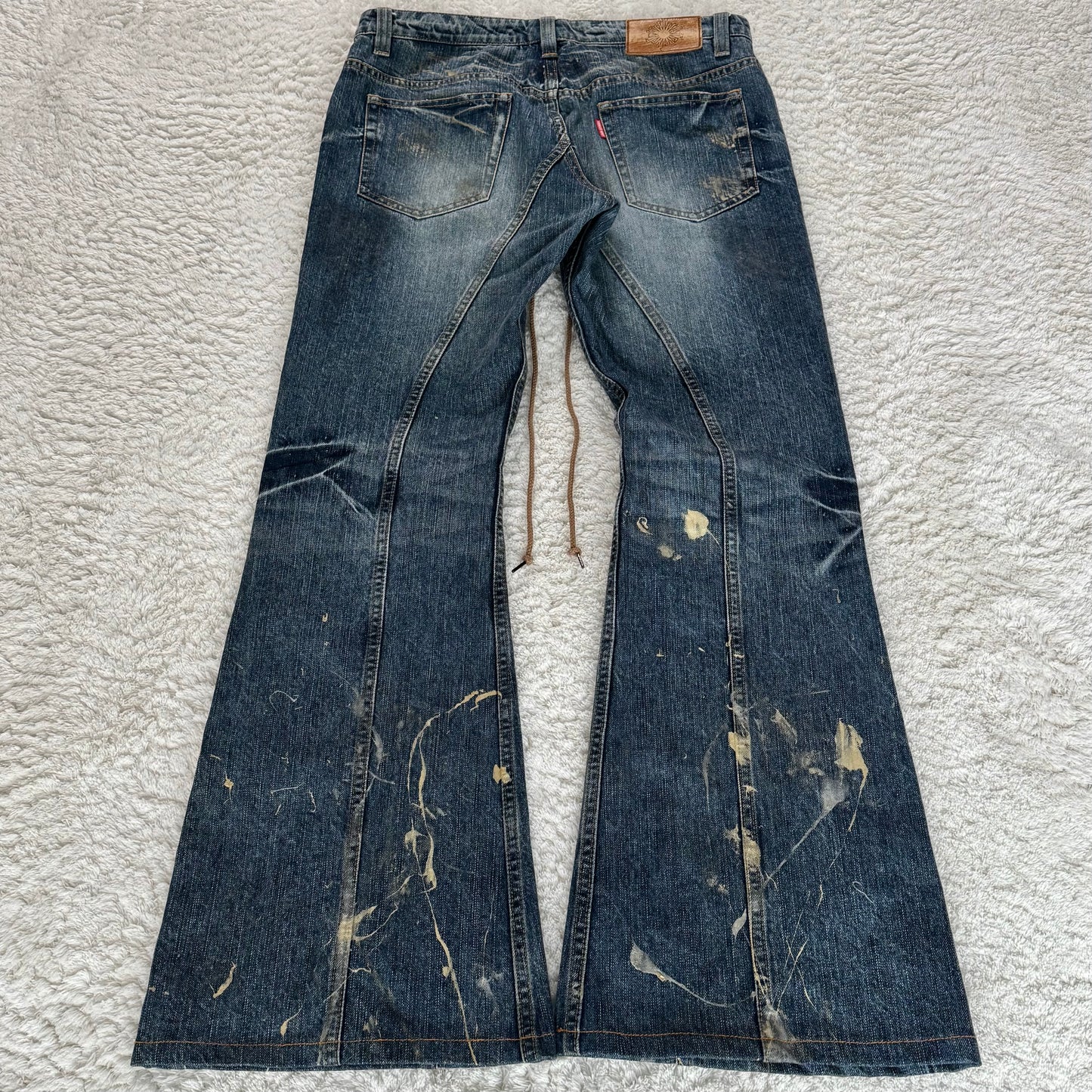 Tornado Mart Gold Splatter Flared Lace Up Jeans