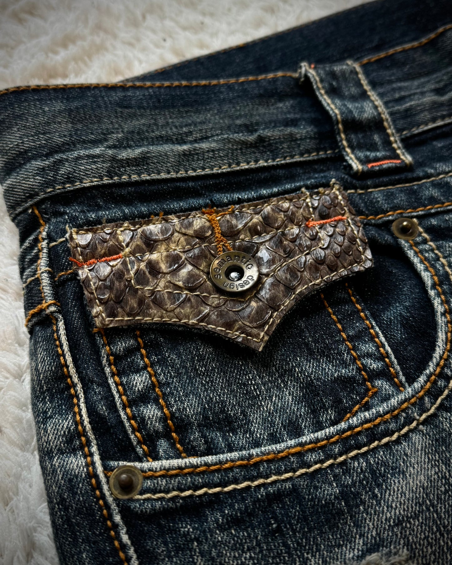 Semantic Design Python Pocket Detailed Spiral Flared Jeans