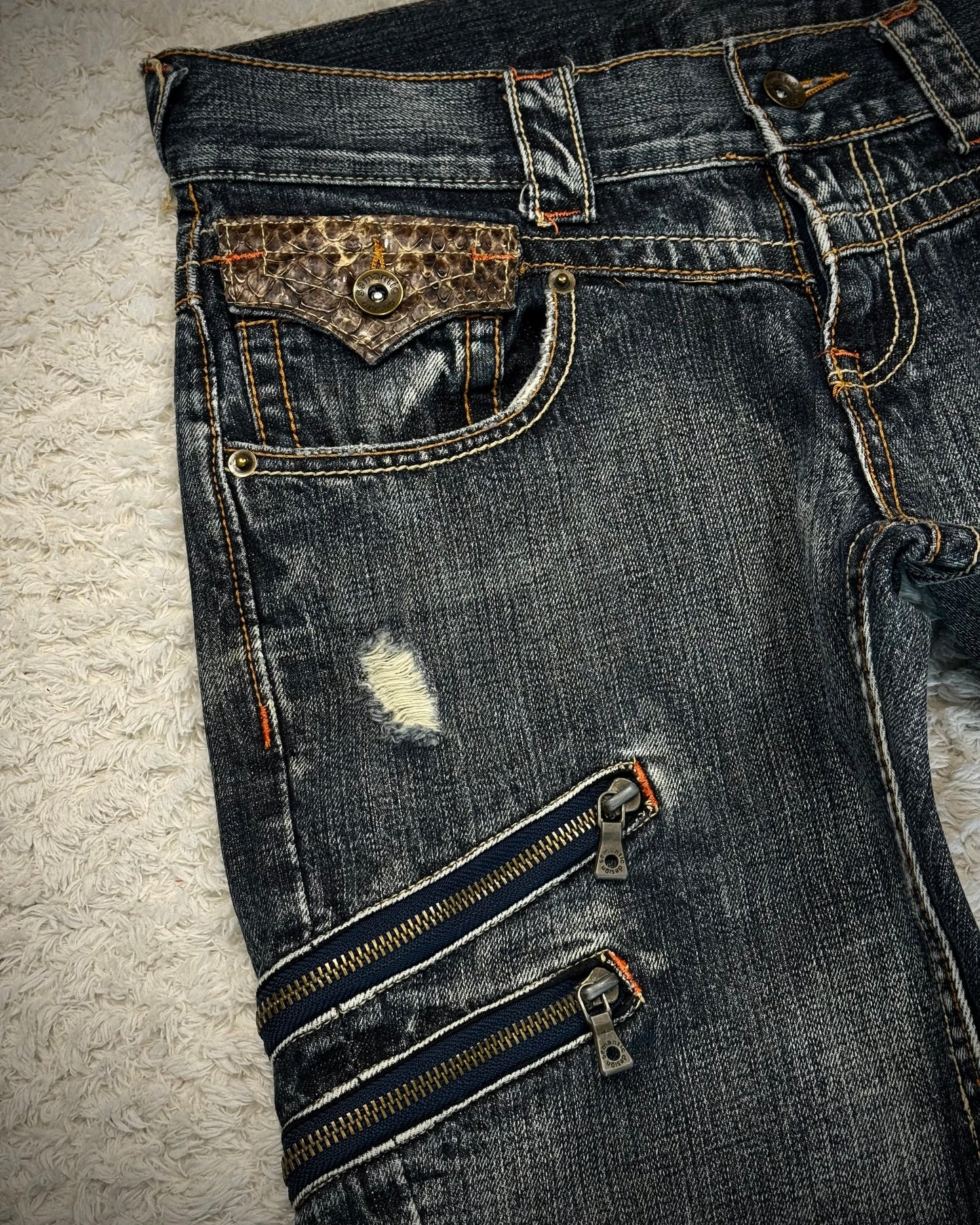 Semantic Design Python Detailed Zippered Spiral Flared Jeans