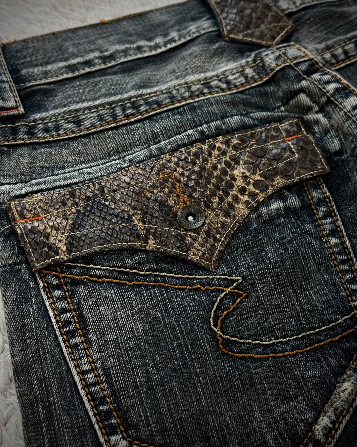 Semantic Design Python Pocket Detailed Spiral Flared Jeans