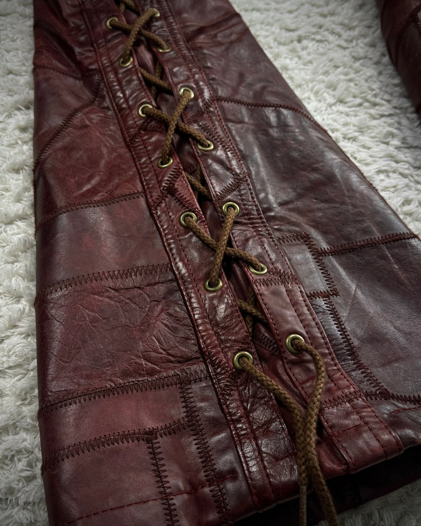 Tornado Mart Oxblood Scar Stitched Leather Patchwork Lace Up Flared Pants