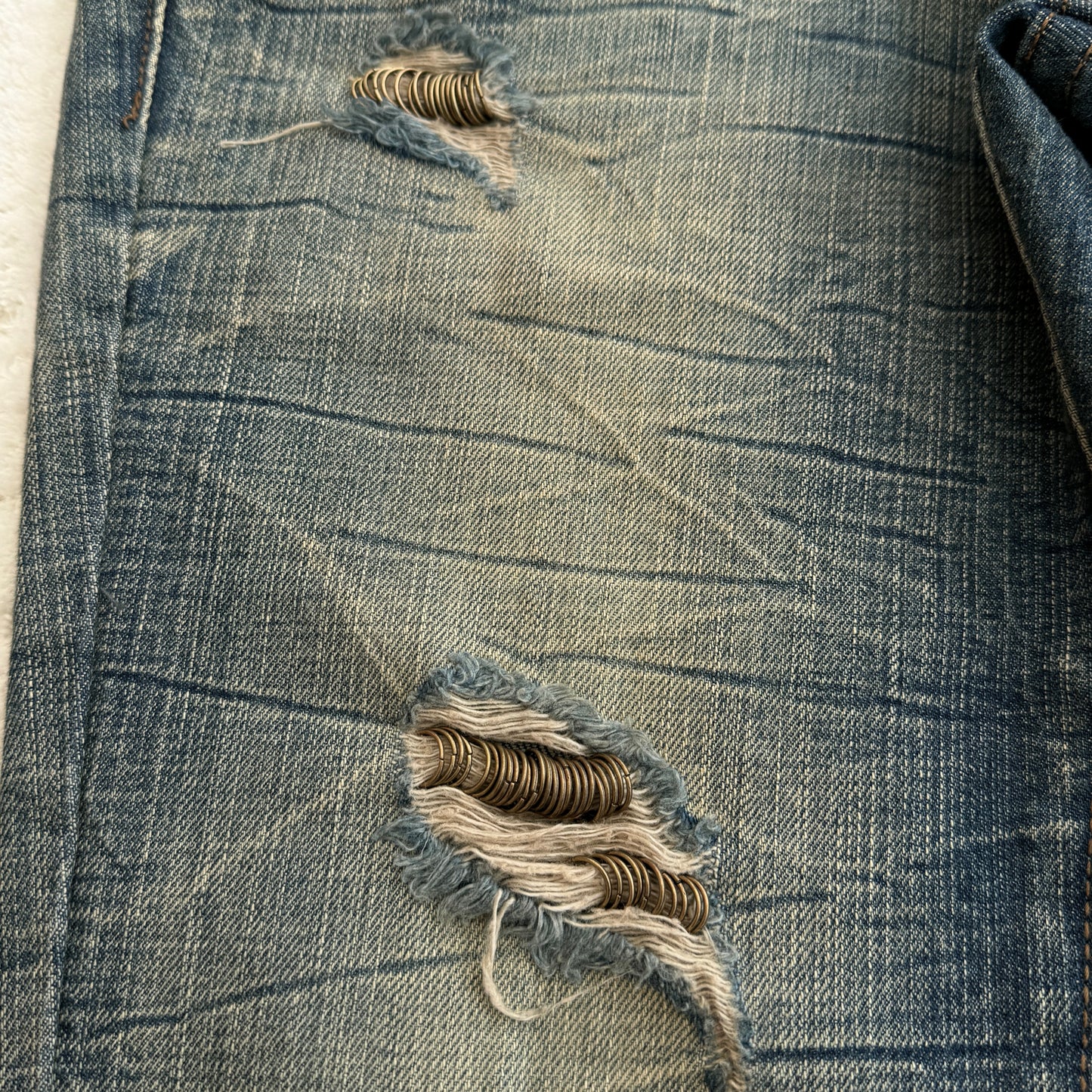 Agate Pierced Mud Wash Flared Jeans