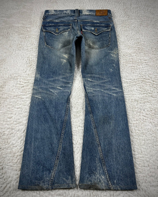 Tornado Mart Repaired Distressing Spiral Flared Jeans