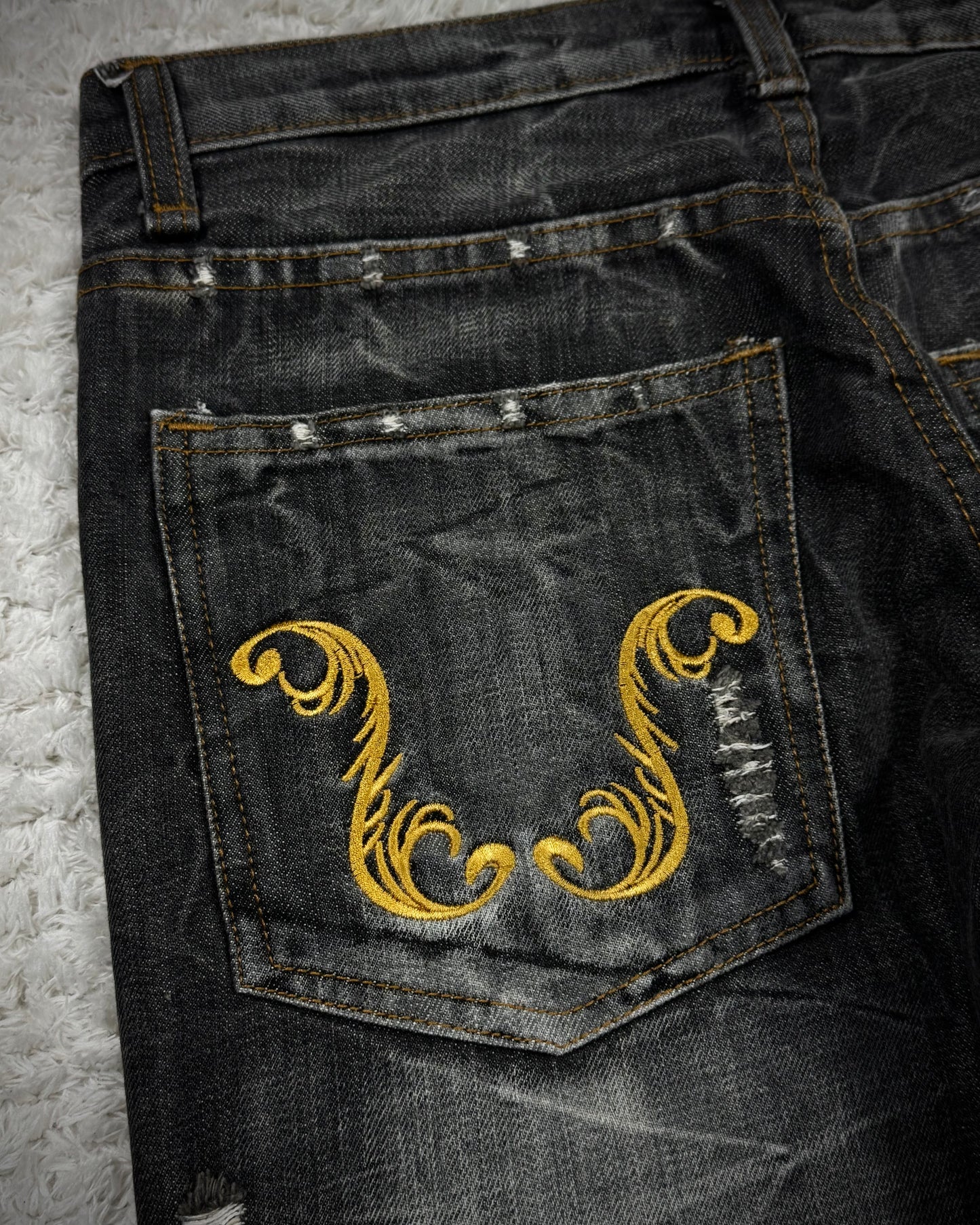 K.U.I Tribal Embroidery Distressed Bootcut Jeans