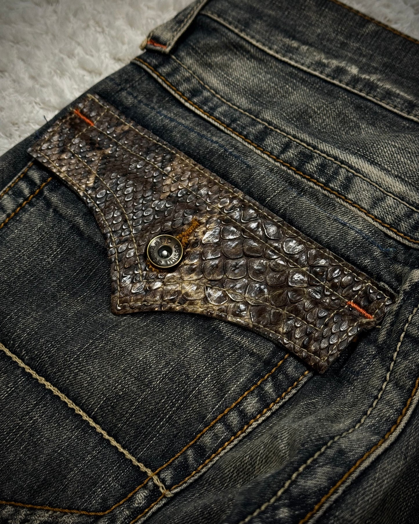 Semantic Design Python Flaps Mud Washed Spiral Flared Jeans