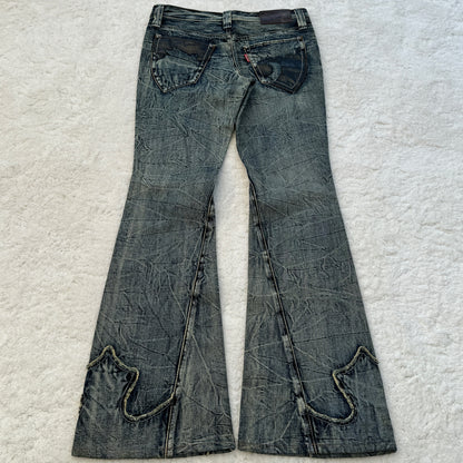 Tornado Mart Flared Flared Jeans with Snakeskin Details