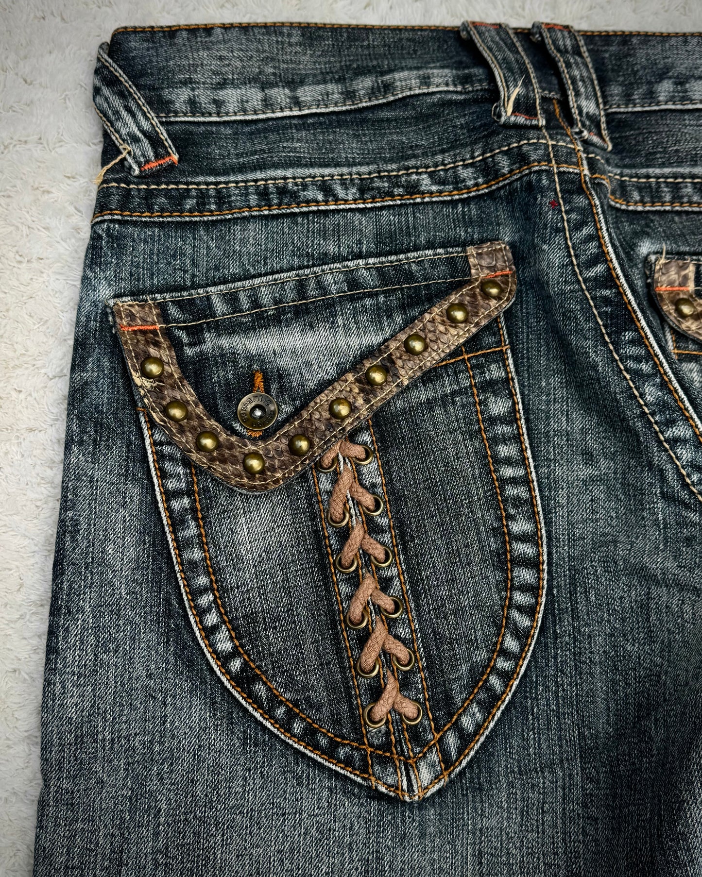 Semantic Design Studded Python Lace Up Flared Jeans