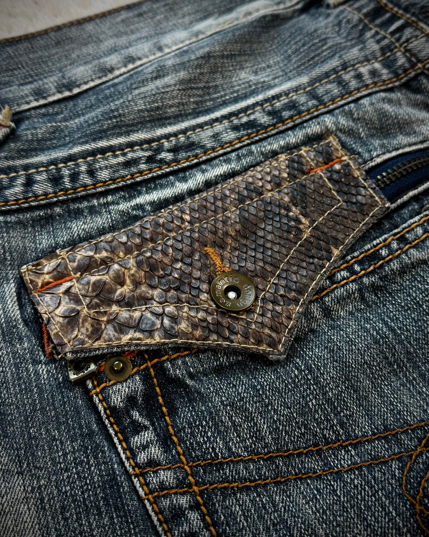 Semantic Design Python Pocket Detailed Spiral Flared Jeans