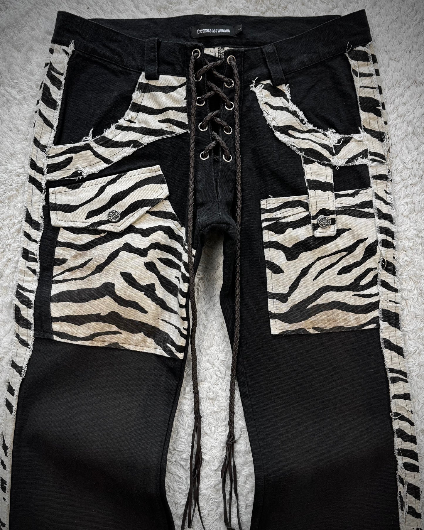 The Space Between Us Zebra Lace Up Flared Pants