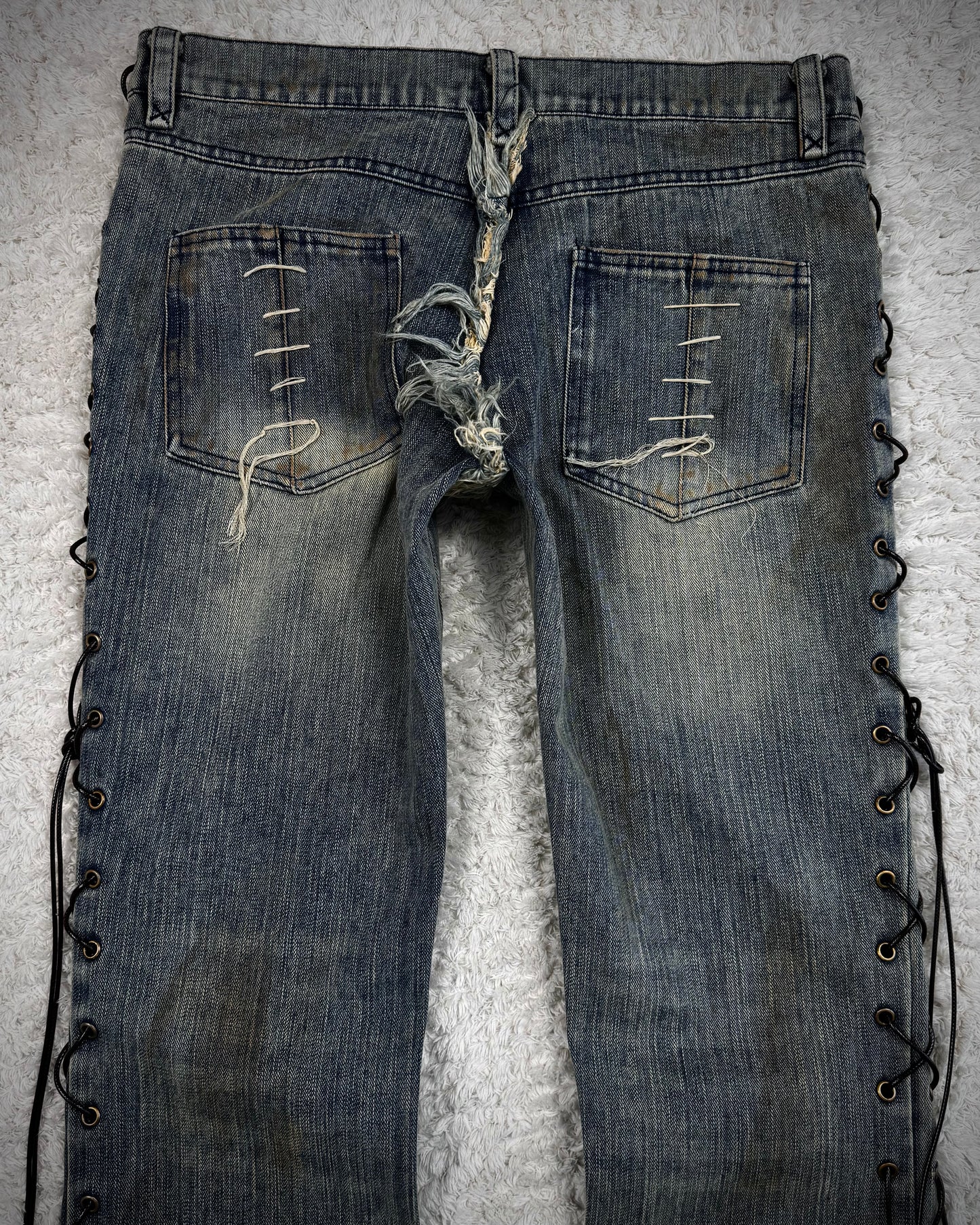 The Space Between Us Mud Washed Lace Up Flared Jeans