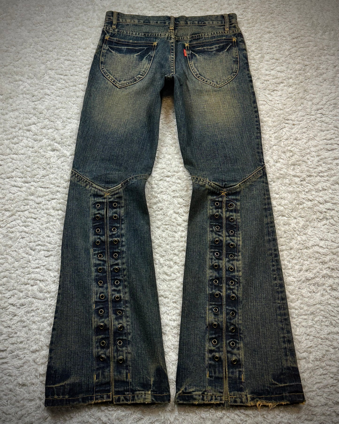 Tornado Mart Mud Washed Grommeted Flared Jeans