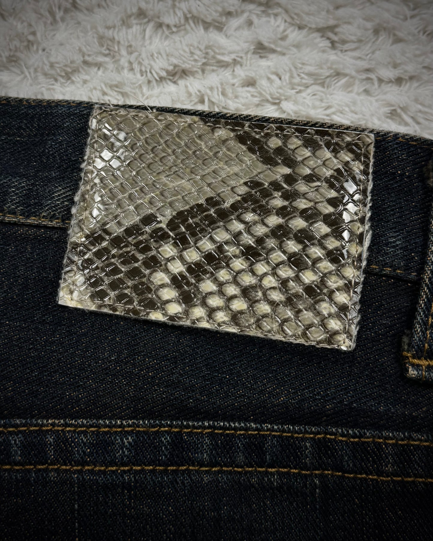 Semantic Design Mud Washed Python Waxed Bootcut Jeans