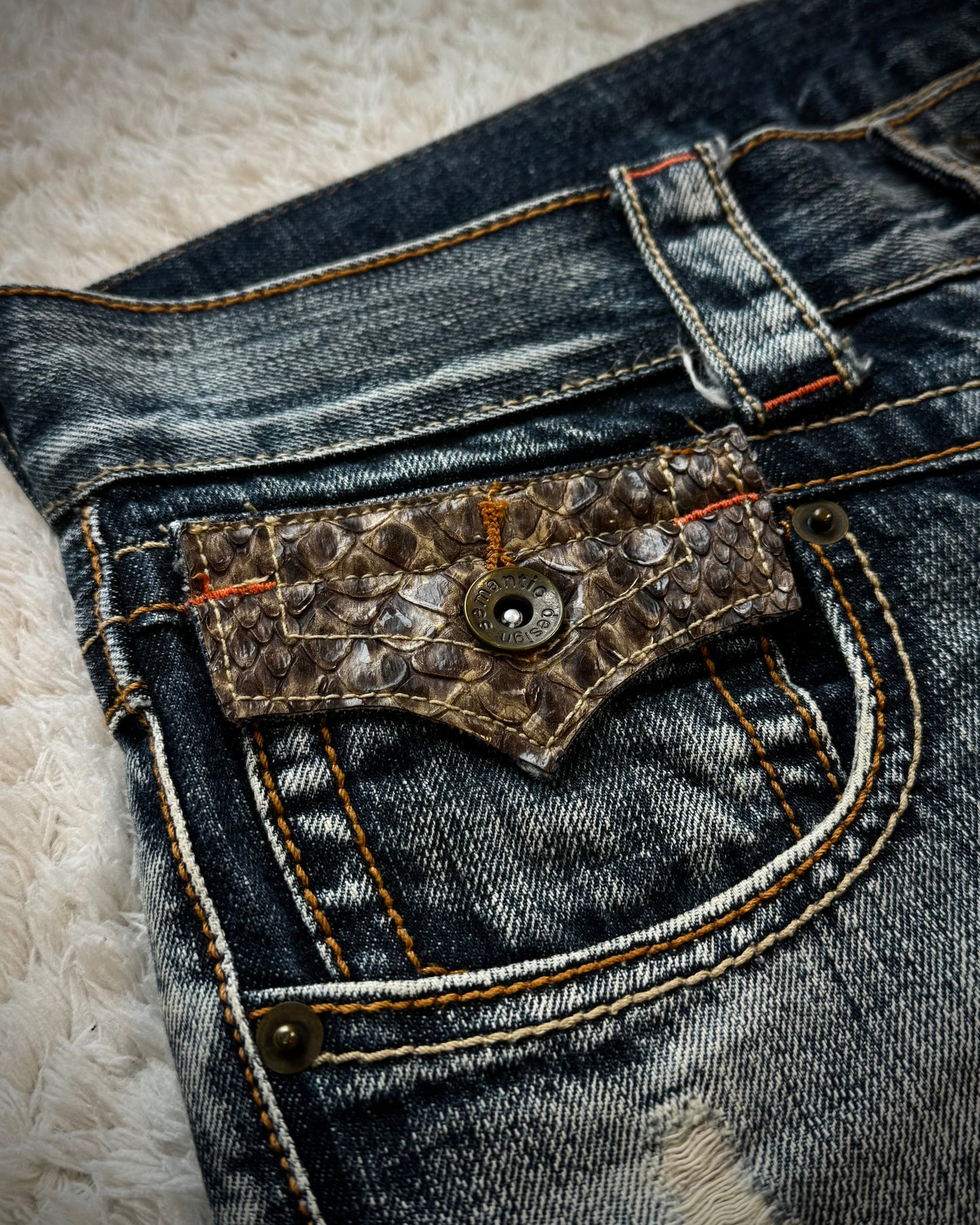 Semantic Design Python Pocket Detailed Spiral Flared Jeans