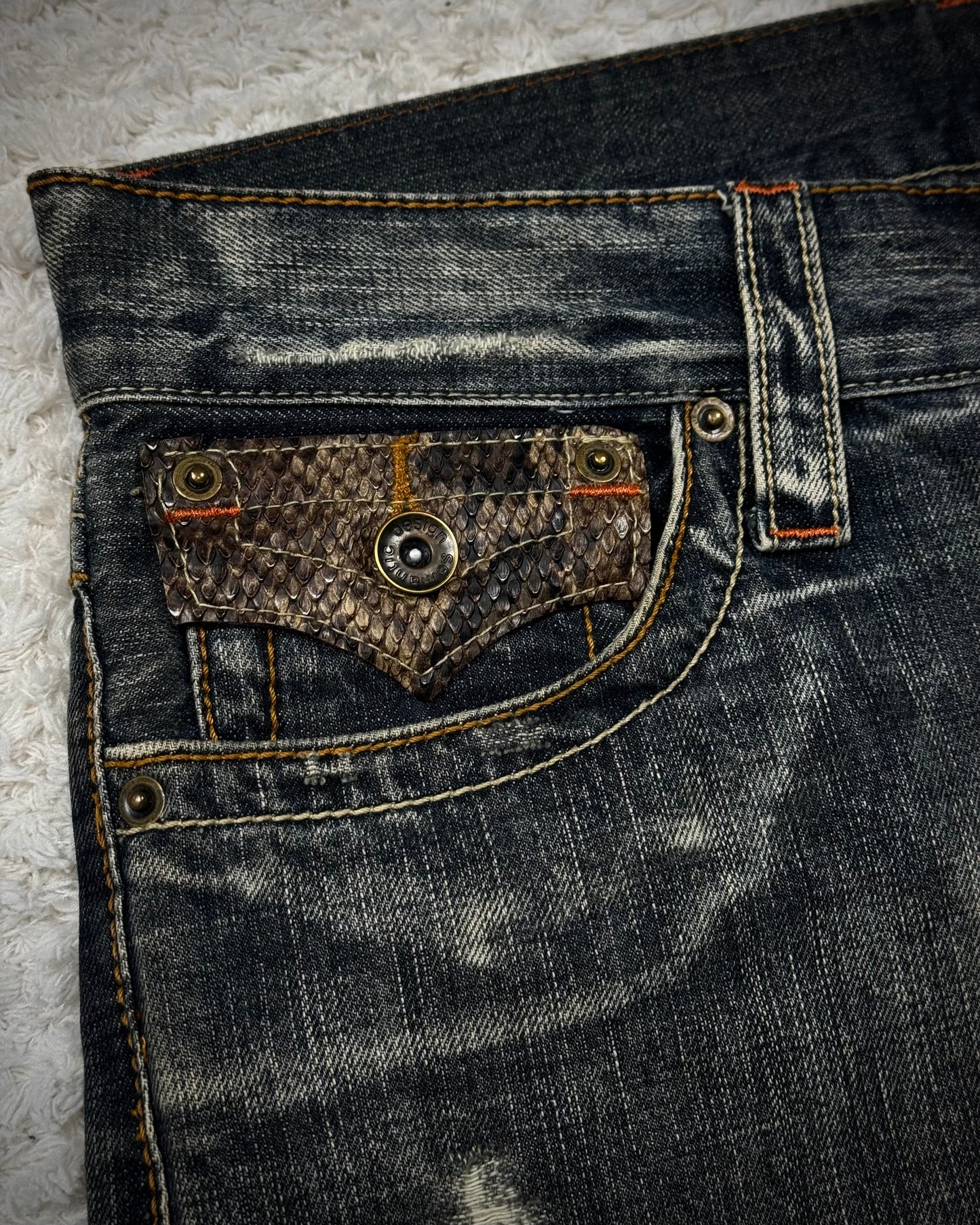 Semantic Design Python Flaps Mud Washed Spiral Flared Jeans
