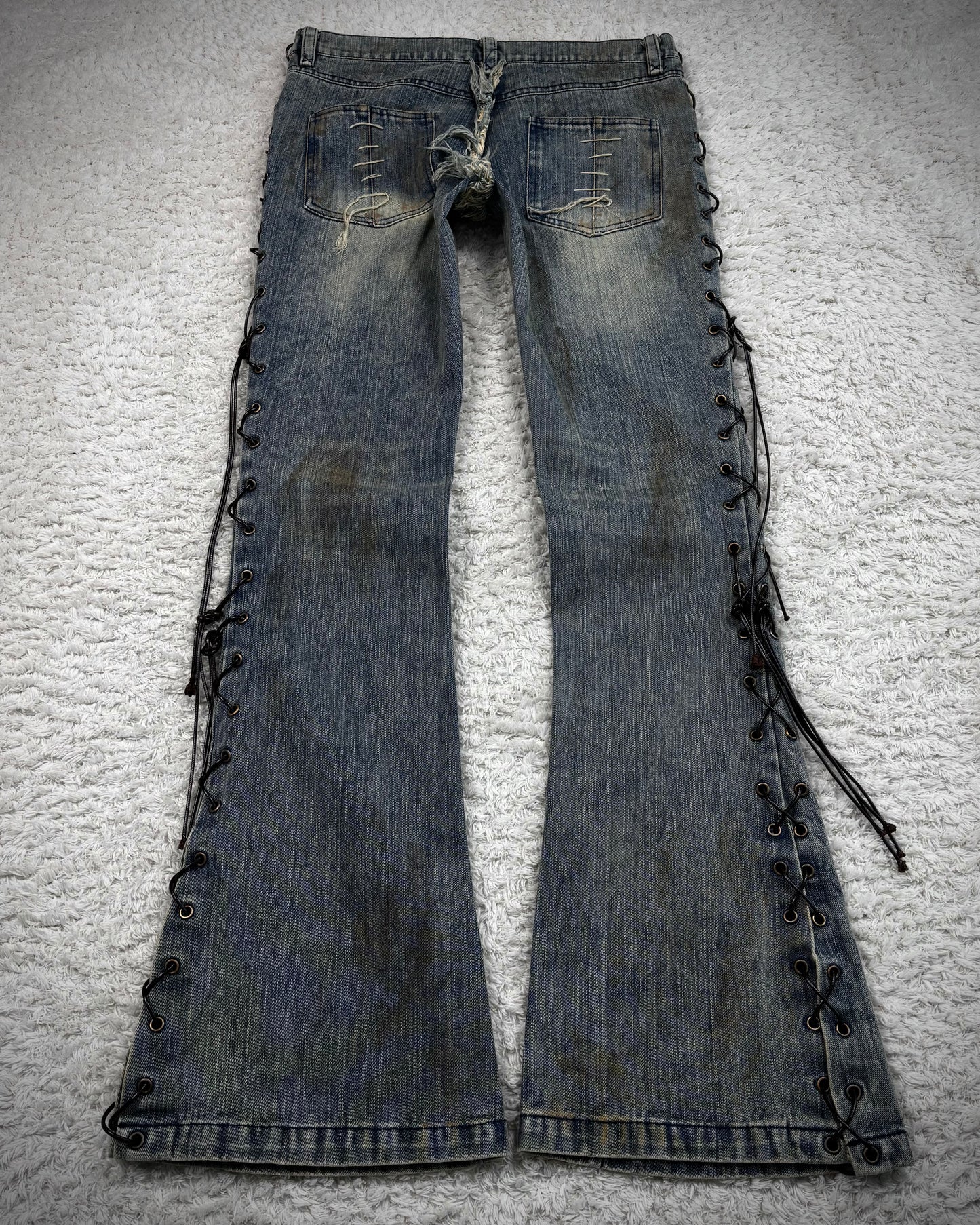 The Space Between Us Mud Washed Lace Up Flared Jeans