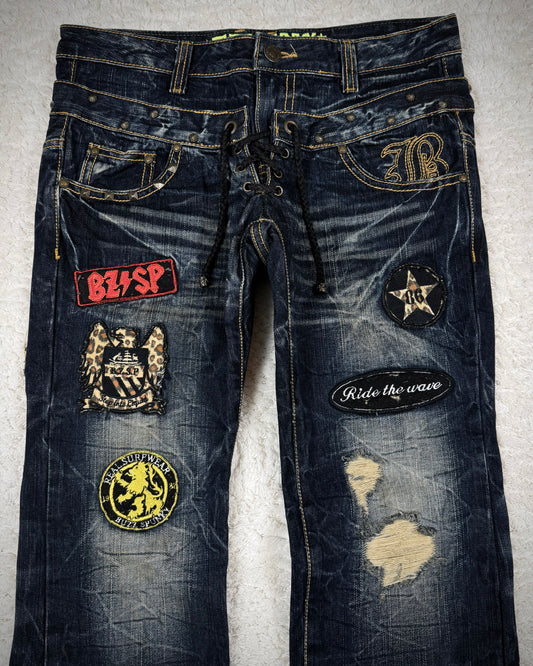 Buzz Spunky Double Waisted Lace Up Studded Patched Bootcut Denim