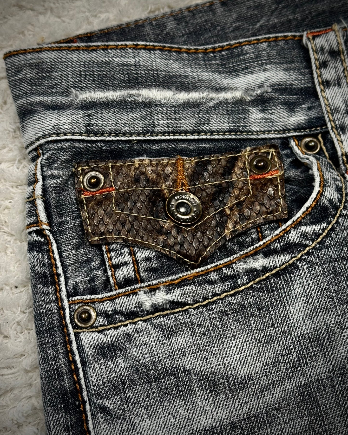 Semantic Design Python Flaps Spiral Flared Jeans
