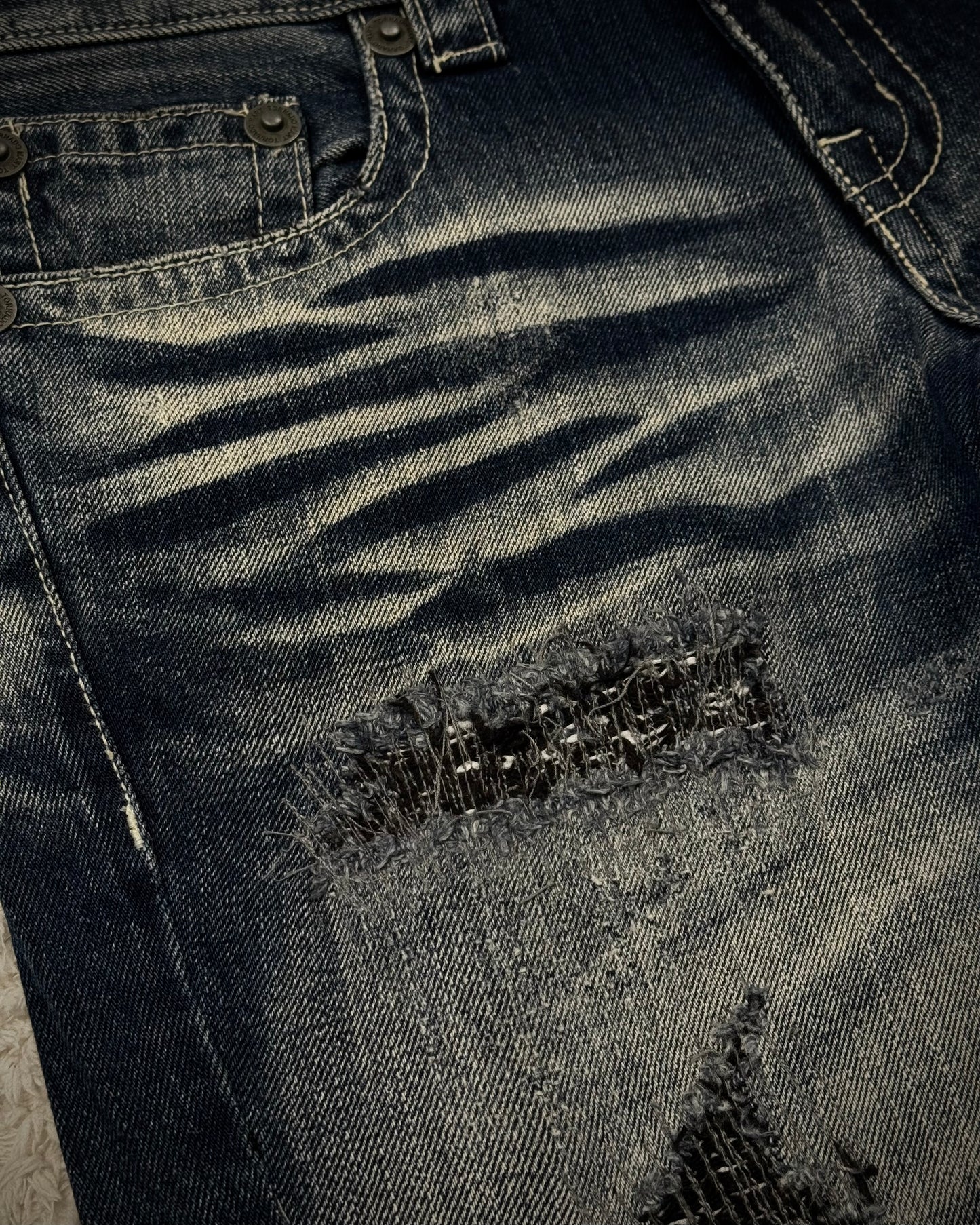 Tornado Mart Stitch Repaired Clawmarks Washed Spiral Flared Jeans