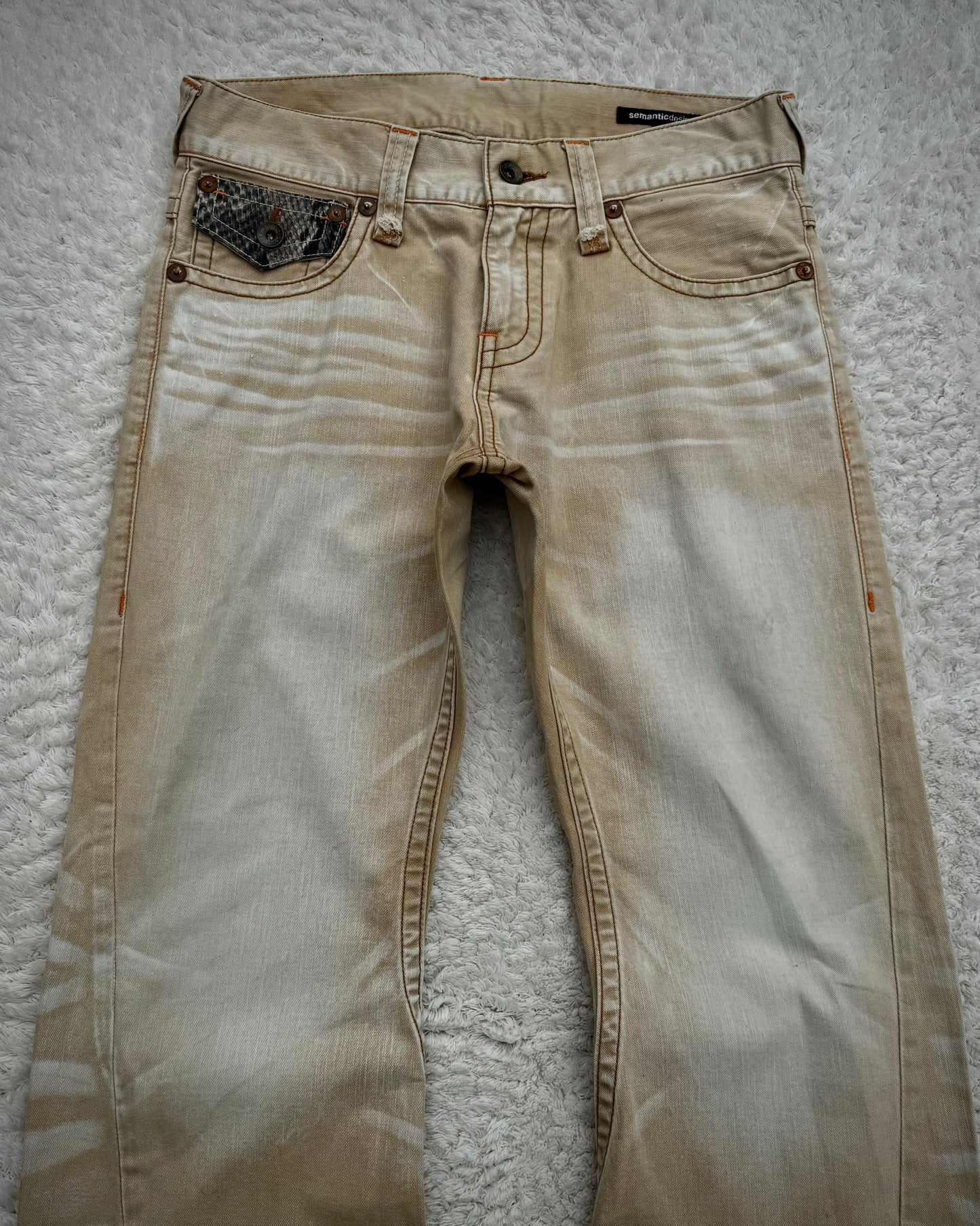 Semantic Design Sand Washed Python Detailed Flared Jeans