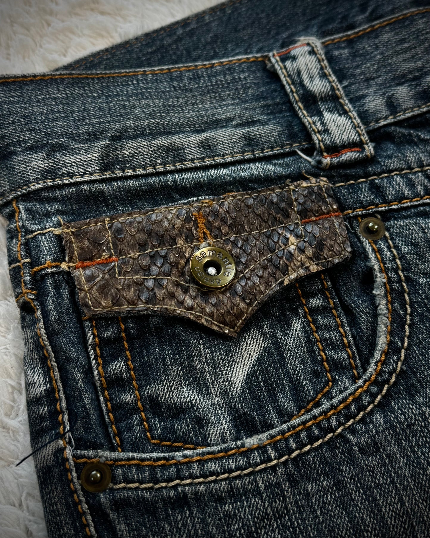 Semantic Design Python Pocket Detailed Spiral Flared Jeans