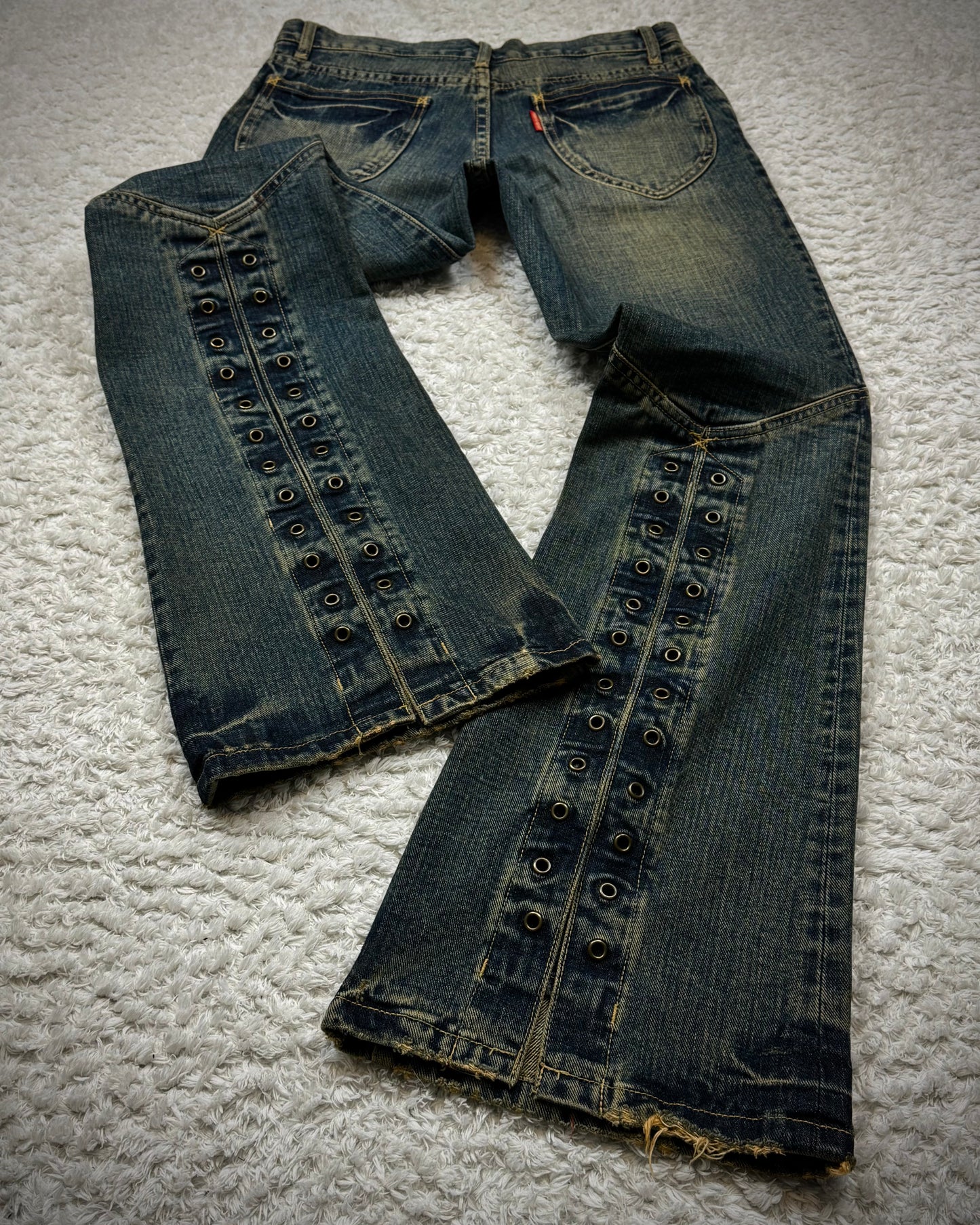 Tornado Mart Mud Washed Grommeted Flared Jeans