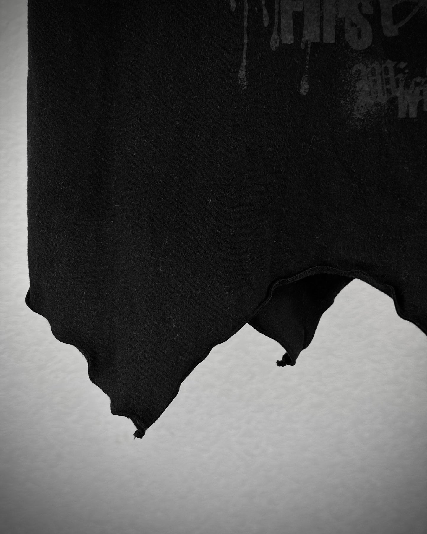 Algonquins Asymmetrical Raw Cut Slash T-Shirt