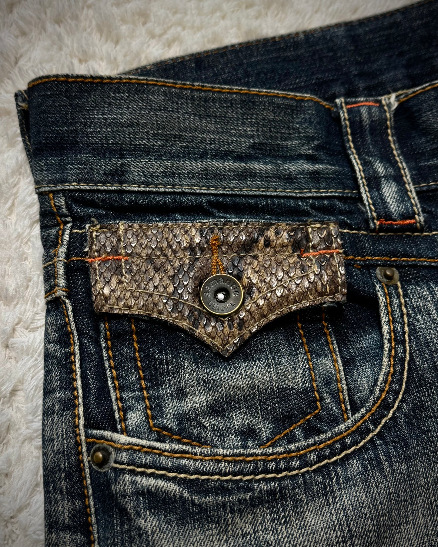 Semantic Design Mud Washed Python Detailed Flared Jeans