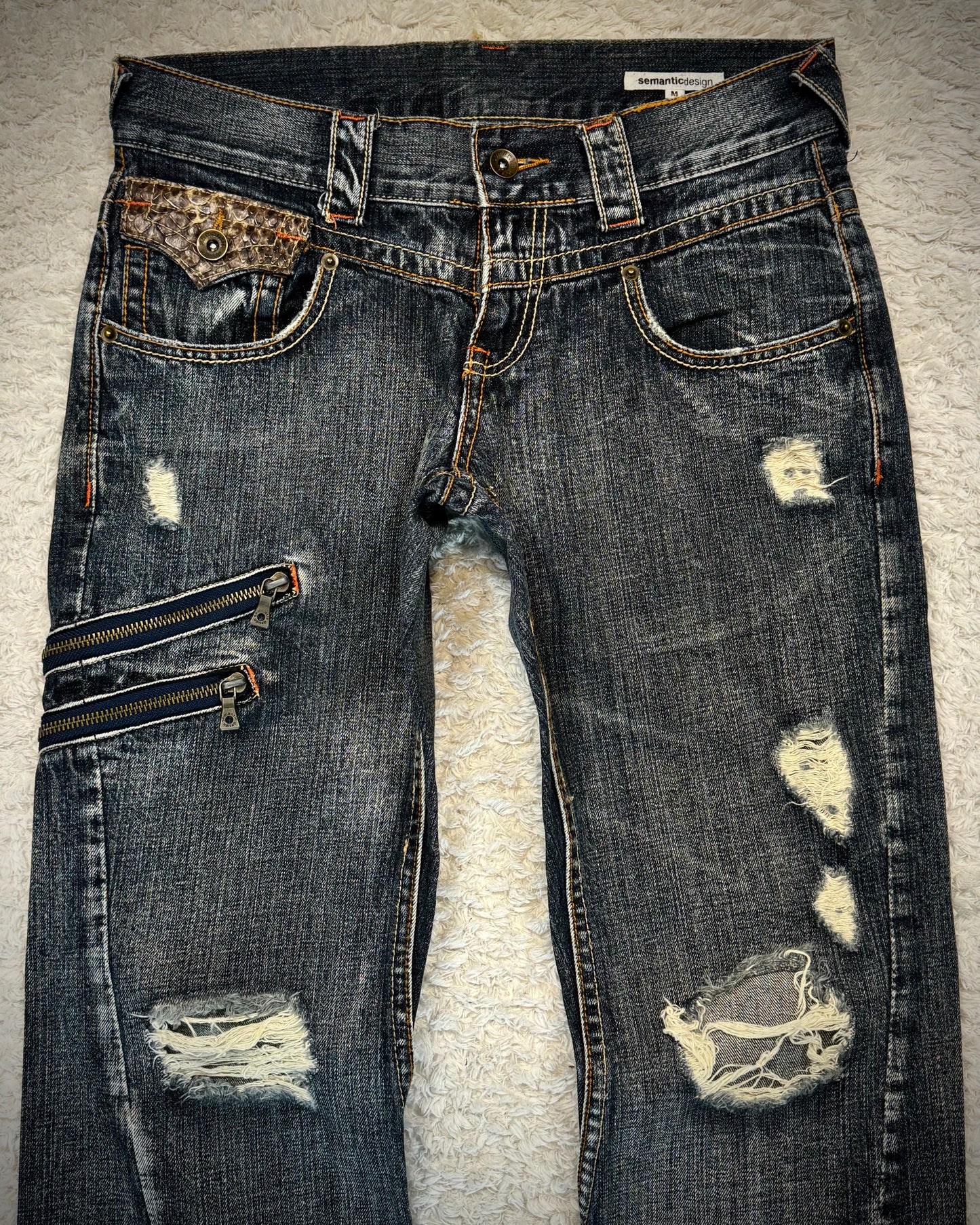 Semantic Design Python Detailed Zippered Spiral Flared Jeans