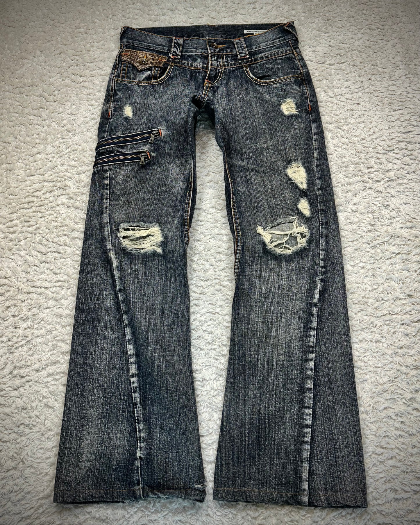 Semantic Design Python Detailed Zippered Spiral Flared Jeans