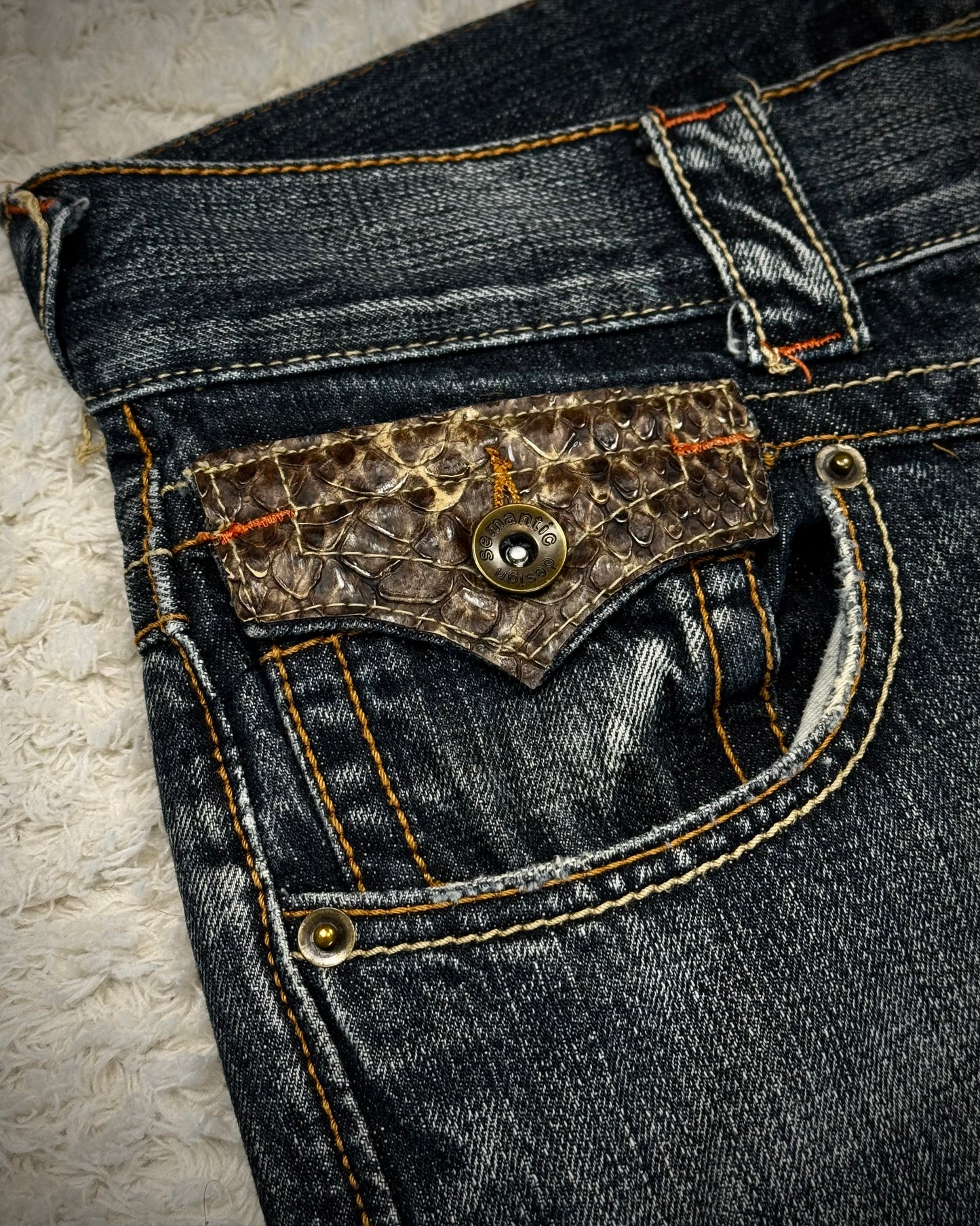 Semantic Design Python Detailed Zippered Spiral Flared Jeans