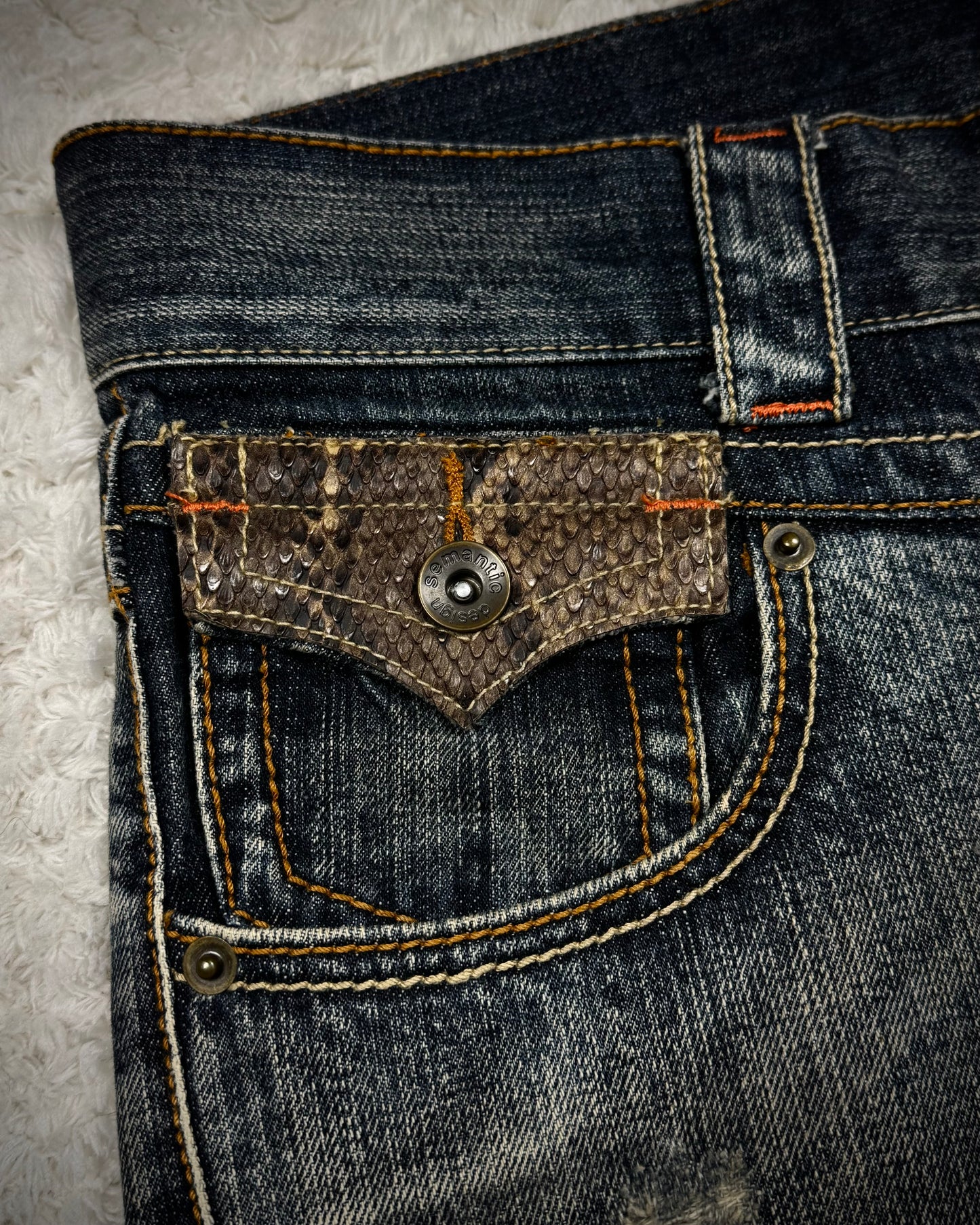 Semantic Design Python Detailed Mud Washed Spiral Flared Jeans