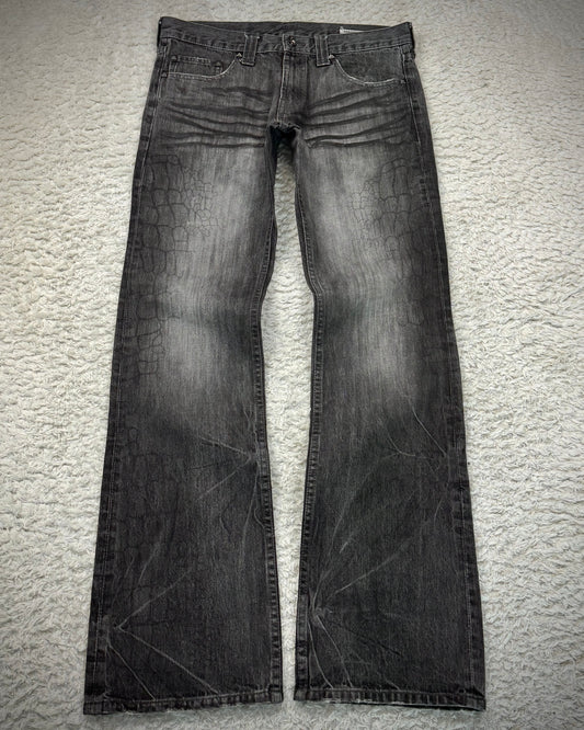 Semantic Design Crocodile Clawmarks Coated Flared Jeans